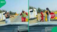 Joyful dance at roadblock: Road worker and woman share unexpected moment in video