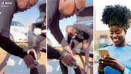Smitten lady appreciates bae in heartfelt video as he dusts off her feet at funeral, Mzansi left in their feels