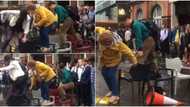 Video shows people mounting chairs to cross flooded street in London, many react