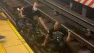 Heroic bystander saves disabled man who fell on train tracks with wheelchair