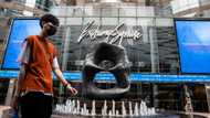Asian markets track higher as investors await US inflation data