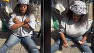 Foodie sits on pavement ready to devour mountain of pap in video, does Wakanda Forever salute as prayer before eating
