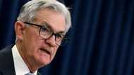 Asian markets fall with Wall St after Fed rate hike, warning