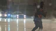 “Superheroes”: South Africans inspired by car guard directing traffic in heavy rain