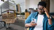 Mzansi divided on man with Honours degree standing with sign for job at traffic light: "Everyone is a judge"