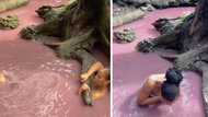 Woman submerges herself in Isinuka Spring's mysterious pink waters to find love