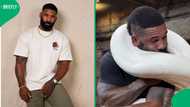 Man struggles to breathe as massive snake wraps around him in tense video
