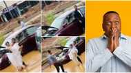 A sign: Reactions as couple's car breaks down on muddy road on wedding day