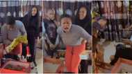 Reactions as woman who sacrificed a lot for siblings faints after being gifted iPhone during birthday party