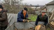 War-weary Ukraine residents chop wood to 'survive' winter