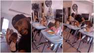 Photos of man babysitting cute triplets while they eat go viral