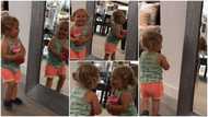 Baby's reaction to her own reflection in a mirror has peeps busting over the viral video