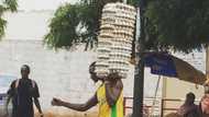 Man shows skill as he walks on wet ground while carrying eggs on 1 arm