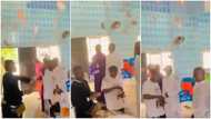 2 Young men spray money on pastors in church, 'dish' new notes into offering basin