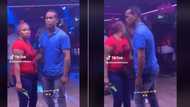 Man dancing with armed woman has TikTok buzzing, Mzansi concerned for his safety at groove