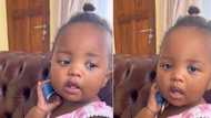 Adorable Xhosa little girl baby talks on pretend phone call, toddler's adult impersonation leaves Mzansi hearts warmed