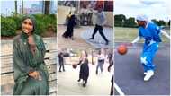 Muslim lady wearing Hijab shows playing skill, dribbles men with ball, scores in a video