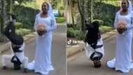 Couple's wedding photo has Mzansi cracking jokes, groom's bizarre pose for special day gets 4M views