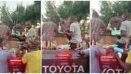 Kind man feeds 150 people from top of a car, video goes viral