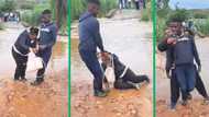 Mzansi cringes watching TikTok video of man carry woman across flooded street then dropping her