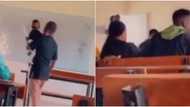 Kind lecturer carries little baby so that mom could focus in class