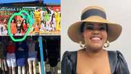Woman randomly finds her pic on local fashion shop sign, pics of her 'billboard' have SA defeated