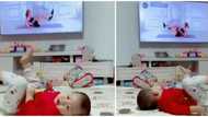 Adorable kid mimics lady doing exercise on television, video goes viral