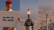 Air hostess climbs on top of world’s tallest building for 1-of-a-kind advert