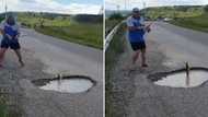 Video of SA man fishing from huge pothole on a road in Kokstad goes viral: "Minister of fish is loading"