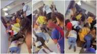 Slay queens fight over money sprayed at house party as they rush to pick it up, one loses her wig in video
