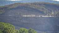 Firefighters contain 'mega-fire' in southern France