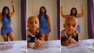 Little boy hilariously blocks curvy mom’s fire dance routine in video, leaves SA men annoyed and unimpressed