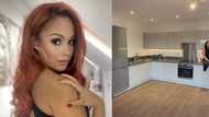 Lady celebrates new home: "Good gracious that kitchen is spacious"