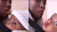 Mom shares funny clip of trying to eat chocolate while holding baby