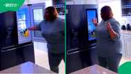 Inspiring TikTok shows lady dancing in her kitchen with an expensive fridge