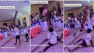 Young man causes stir at event as he holds a bench with only his teeth while doing legwork in video