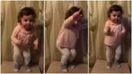 Cute kid vibes to 1958 rock hit song, shows great excitement at the beat; many react