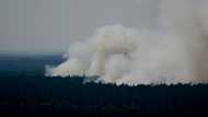 Blasts ring out as fires rage in Berlin forest