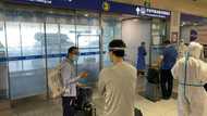 China halves quarantine time for overseas travellers