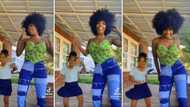 Gorgeous mom with poppin’ afro and sweet daughter leave the internet screaming over their fire dance clip