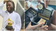 Burna Boy beams with excitement as he receives a customised Grammy wristwatch