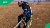 "Salary better match the danger": Man hangs on tall electric cable in risky job in TikTok video, SA floored