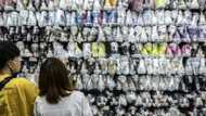 Bank of Japan sticks to easing, raises inflation forecast