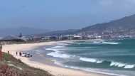 Video shows cops rescuing police van stuck on beach as tide rises