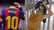 Tears as Barcelona fan parks outside Camp Nou, filmed crying while holding Lionel Messi jersey
