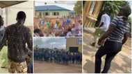 Young man storms school, causes commotion among students as he rains cash in video