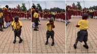 Shy little schoolboy causes stir in school, winds waist like a lady as he dances in front of students in clip