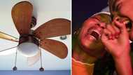 Woman dancing on the table gets hit on the head by ceiling fan, she continues like nothing ever happened