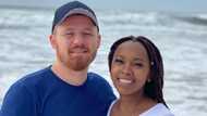 Interracial couple serve goals as the man helps his lady with her hair