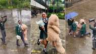 Pretoria school romance: Mzansi moved as boy surprises bae by kneeling in rain with Valentine's Day gifts